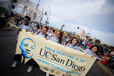 https://www.voicesforhopejournal.com/wp-content/uploads/2025/03/mlk-parade-2020.jpg