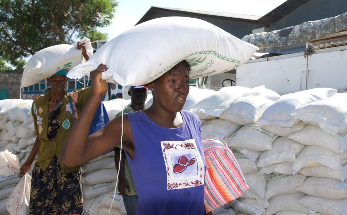 Women who received bags of lentils from a distribution site in Gonaives, Haiti, carry their food and cooking oil off to their homes weeks after Hurricane Ike. Photo: ID 7543780 © David Snyder | Dreamstime.com Women who received bags of lentils from a distribution site in Gonaives, Haiti, carry their food and cooking oil off to their homes weeks after Hurricane Ike. Photo: ID 7543780 © David Snyder | Dreamstime.com