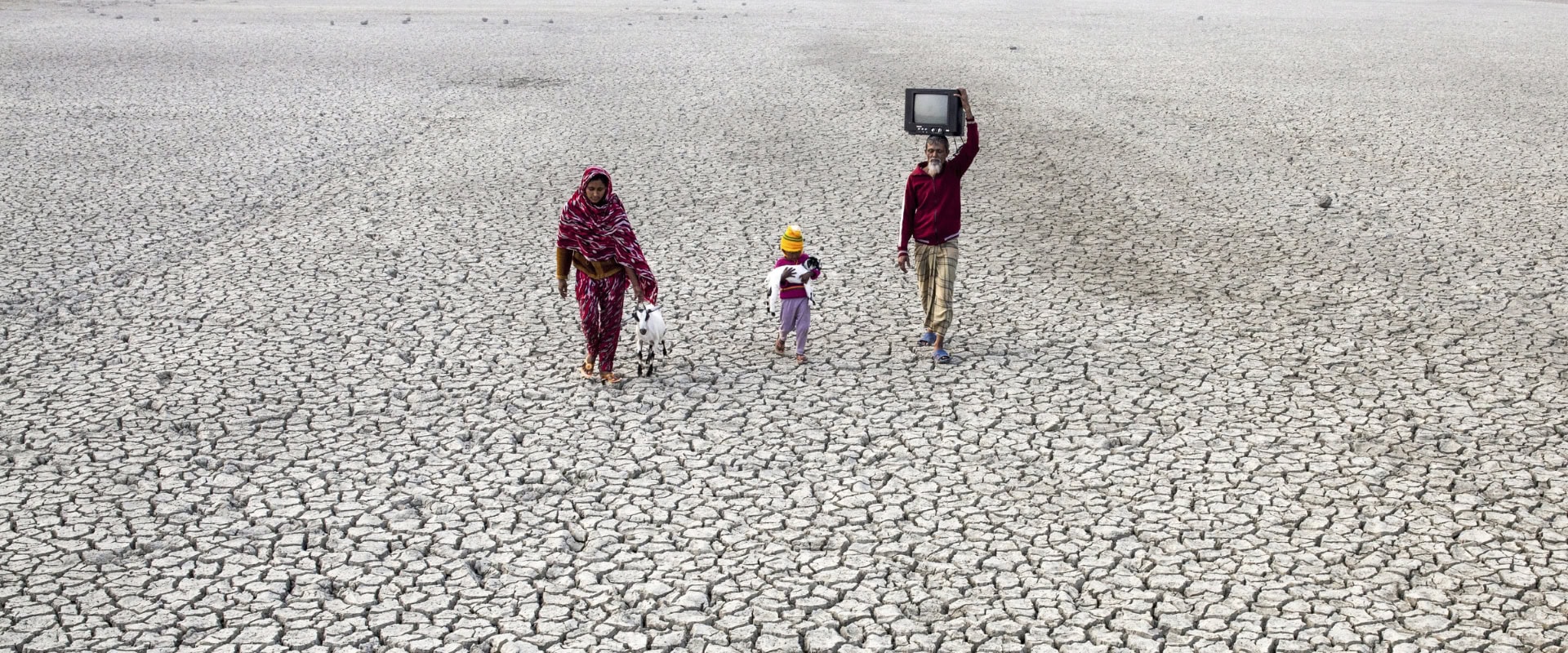 Local villagers seen on the dried river bed in Satkhira, Bangladesh. Bangladesh is one of the most vulnerable continental countries to climate change. Photo by Zakir Hossain Chowdhury / Barcro / Barcroft Media via Getty Images