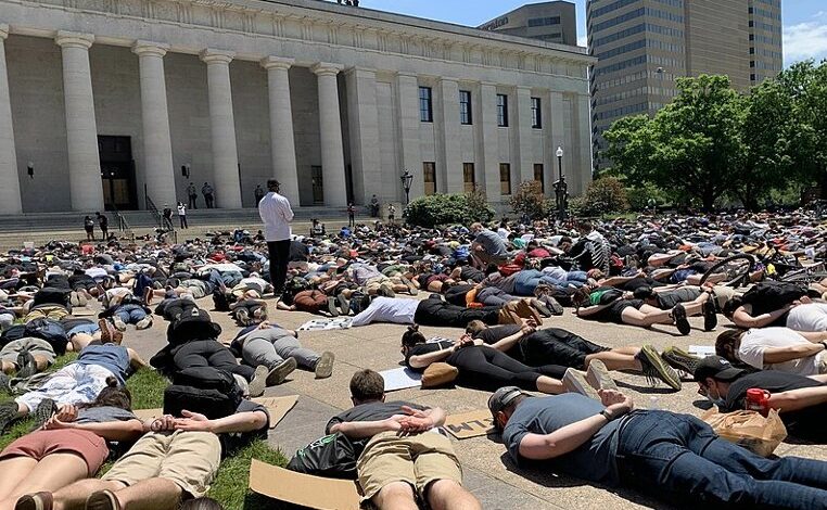 Can we save the world without free will?