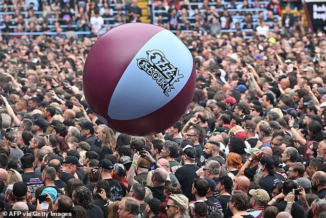The Villa Park crowd plays with a huge beach ball during the 'Back to The Beginning' concert