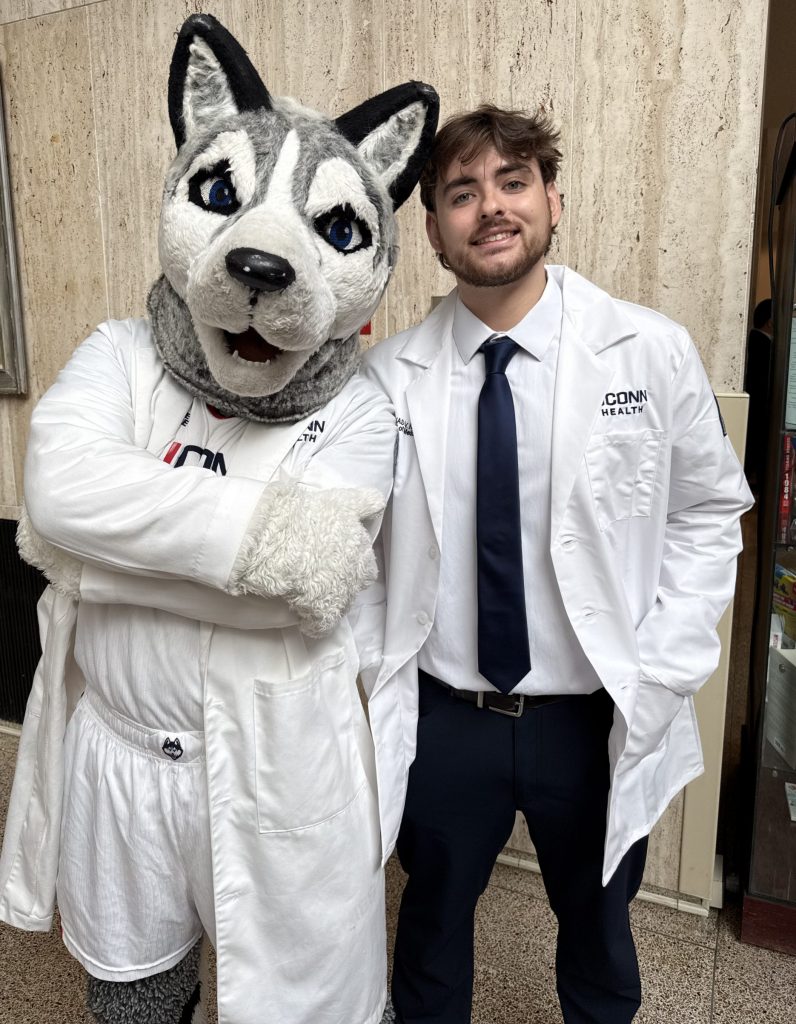 Lukas Klin celebrating his childhood dream coming true of entering UConn medical school with Jonathan! (Lauren Woods/UConn Photo). 